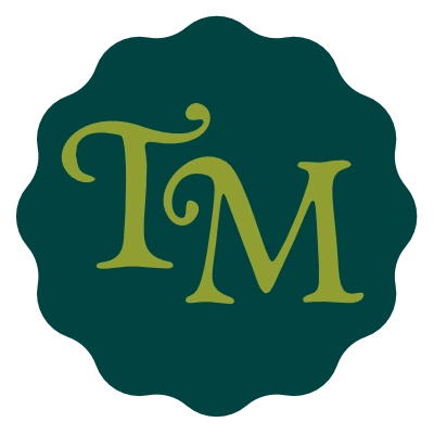 Olive TM monogram on a dark green scalloped badge