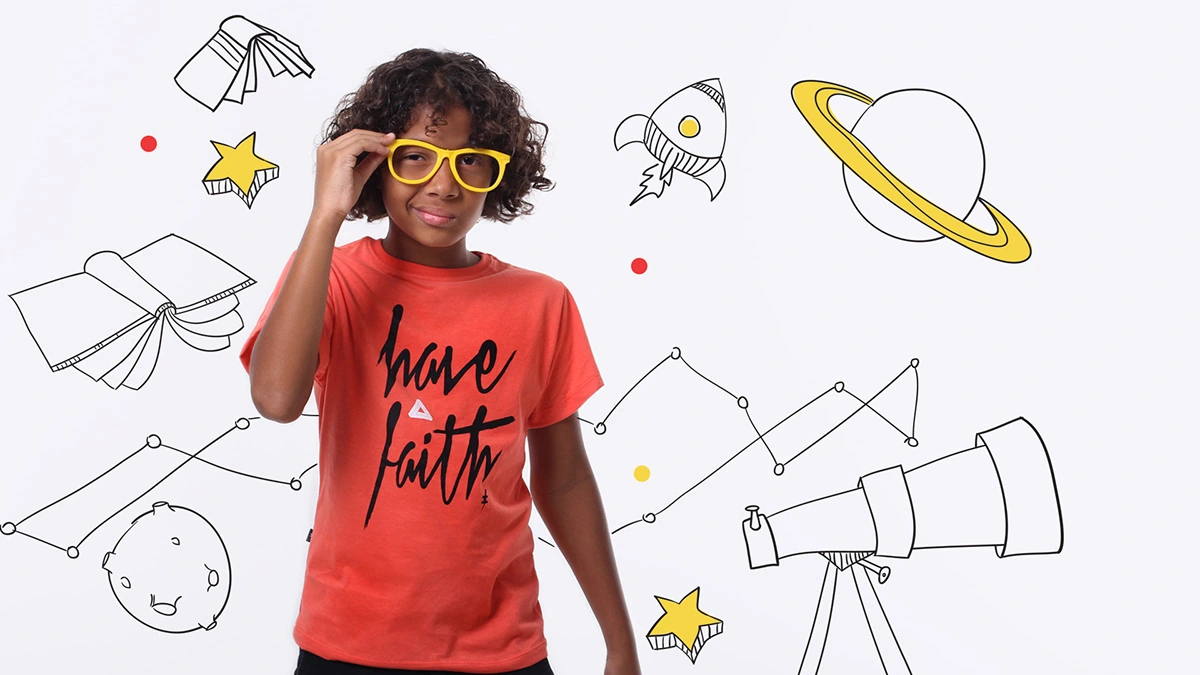 Child in yellow glasses surrounded by illustrated planets, books, stars and a telescope